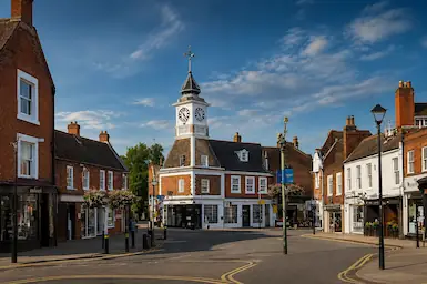 Ampthill town centre with historic clock tower and traditional shopfronts, representing TradeHub Platform helping local trade businesses build stronger websites, improve local SEO and grow their online visibility.