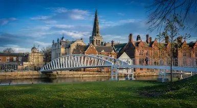 Bedford riverside skyline with bridge and historic buildings, representing TradeHub Platform helping local trade businesses improve online visibility through professional websites, local SEO and digital growth systems.