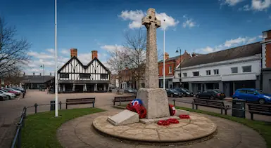 Biggleswade town centre with war memorial and traditional buildings, representing TradeHub Platform supporting local tradespeople with professional websites, local SEO and stronger online business visibility.